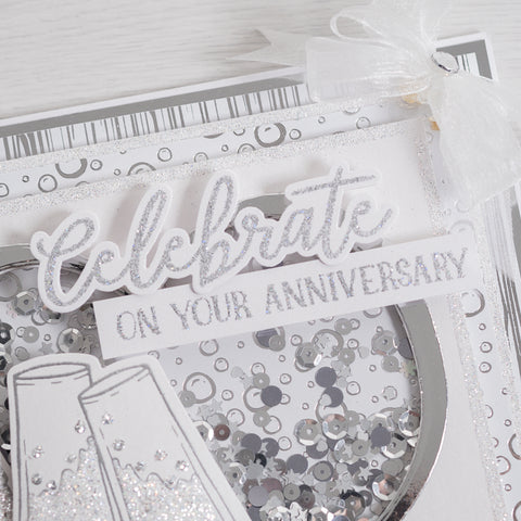 Learn how to create this sparkling champagne bottle anniversary card using our new celebrate sentiment builder stamp and champagne glasses stamp from Chloes creative cards