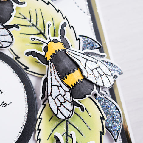 Learn how to make this gorgeous illustrated bee wreath style greetings card using products from Chloes Creative Card. This card is filled with colourful detail and glitter accents - ideal for a Queen Bee herself!