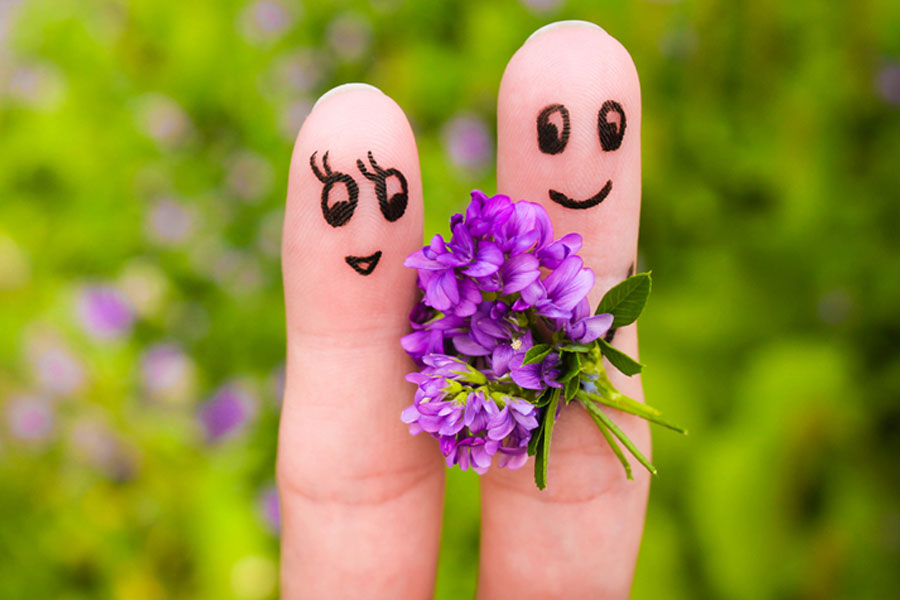 finger puppets, man holding flowers for happy woman, how to ask someone out tips