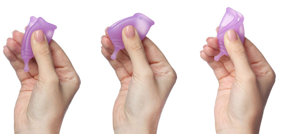 hand showing how to fold a menstrual cup