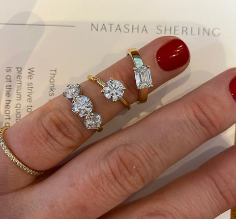 Natasha Sherling three stone emerald cut round brilliant diamond rings