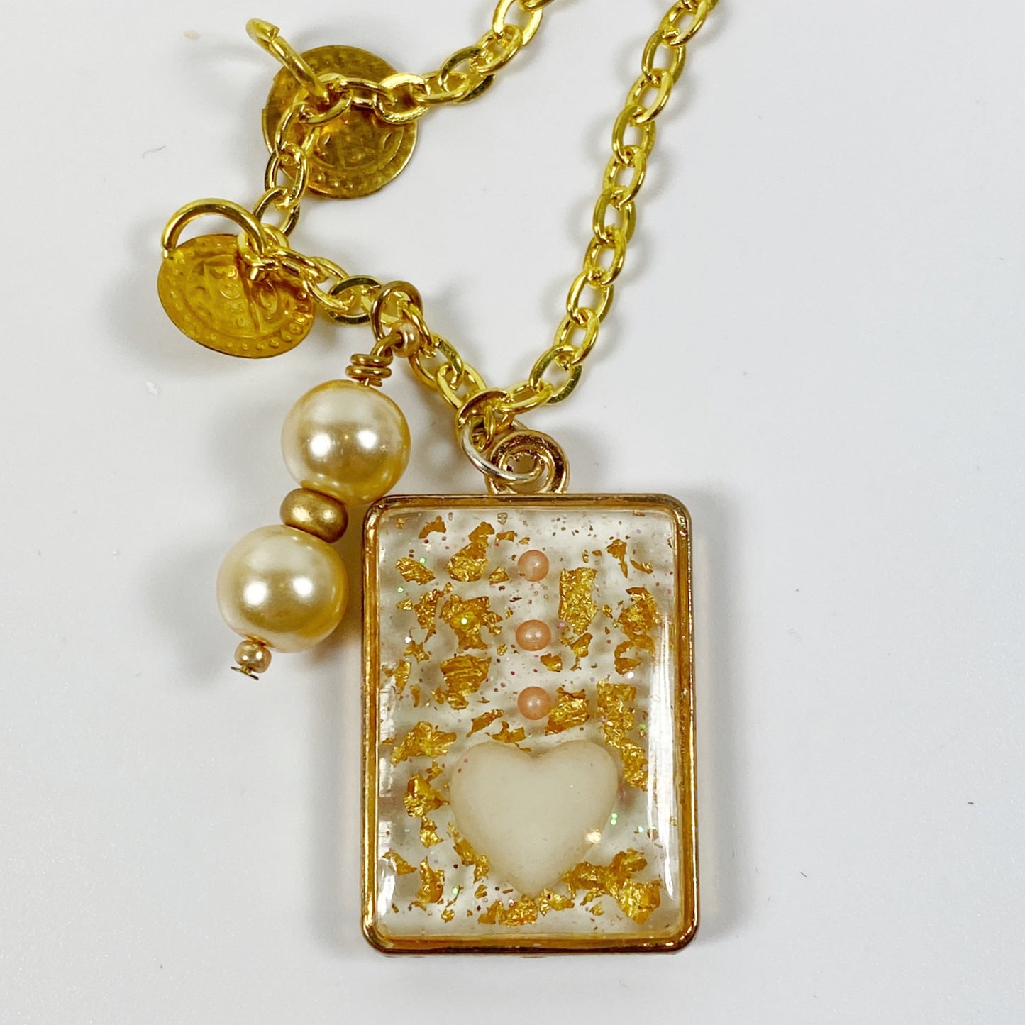 White Heart in Gold Leaf Resin Pendent Necklace with Pearls close up