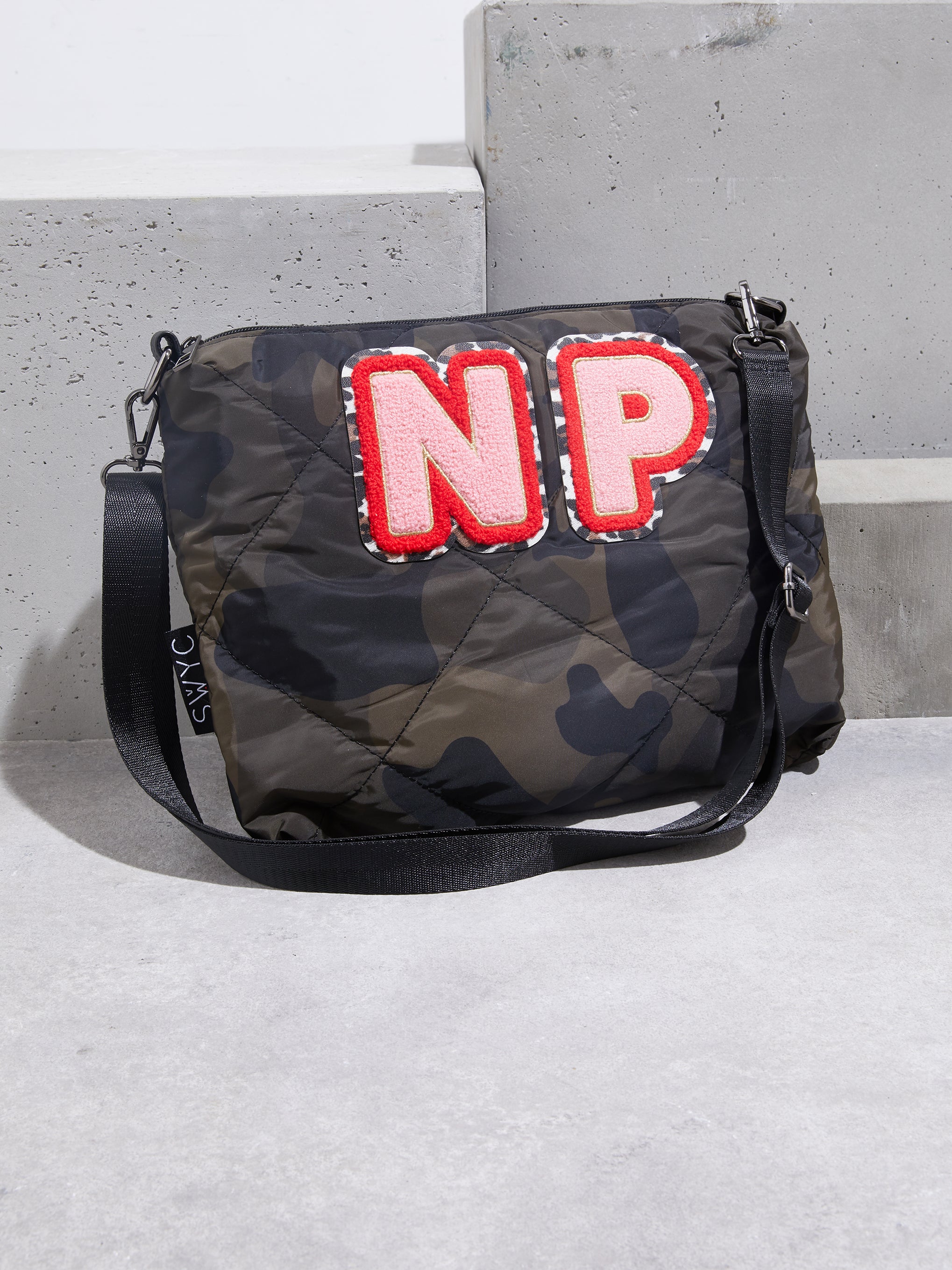 Camo print quilted messenger bag