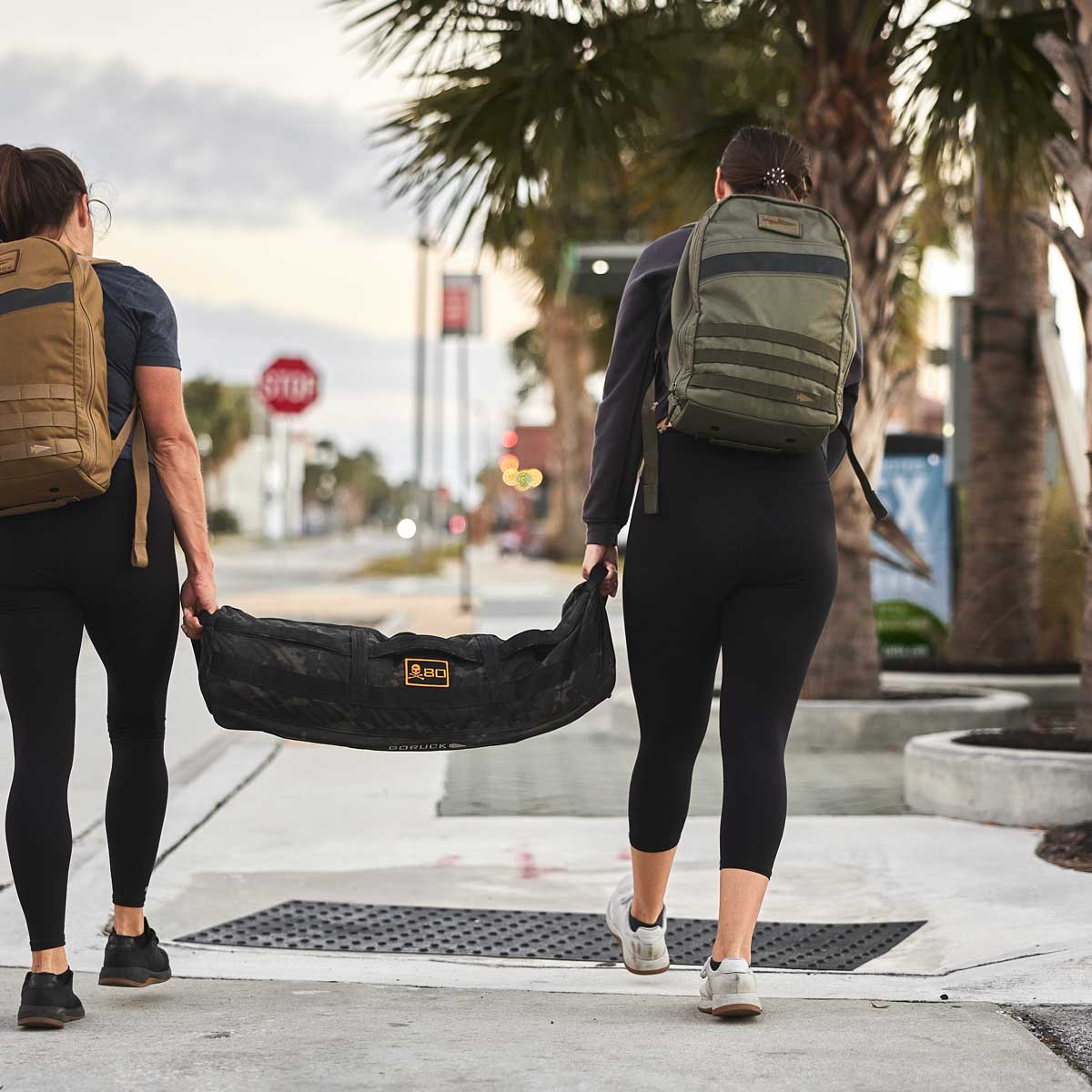 sandbag carry buddy workout