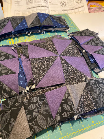 Putting together the half square triangles into a quilt block