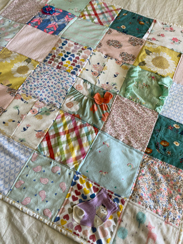 Maria Fisher's finished baby clothes, baby quilt