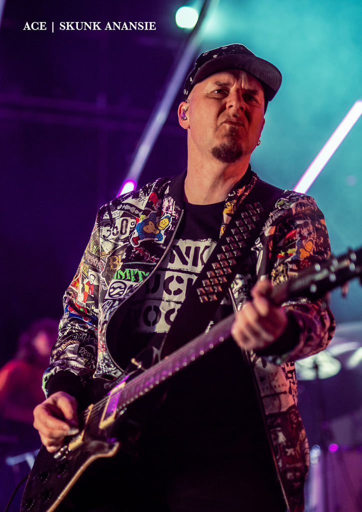 Ace Guitarist Skunk Anansie British Rock Band wearing No Fixed Abode Punkrock Sticker Bomber Jacket