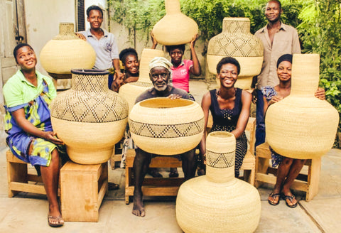 ghana master weavers holding baskets 