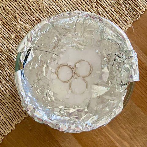 Sterling silver rings covered with baking soda