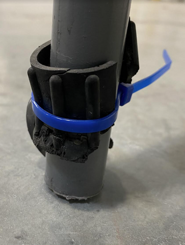 Broken rubber tip foot for rolling ladder leg with zip tie