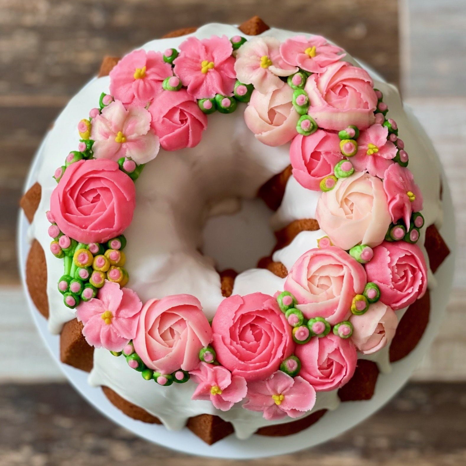 decorating a bundt cake with flowers