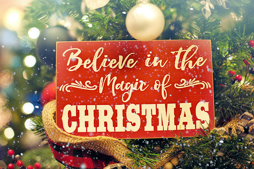A Christmas card that reads, "Believe in the magic of Christmas."