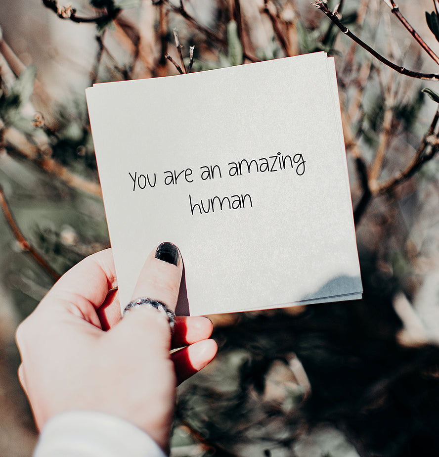 A handwritten card that reads "You're an amazing person."