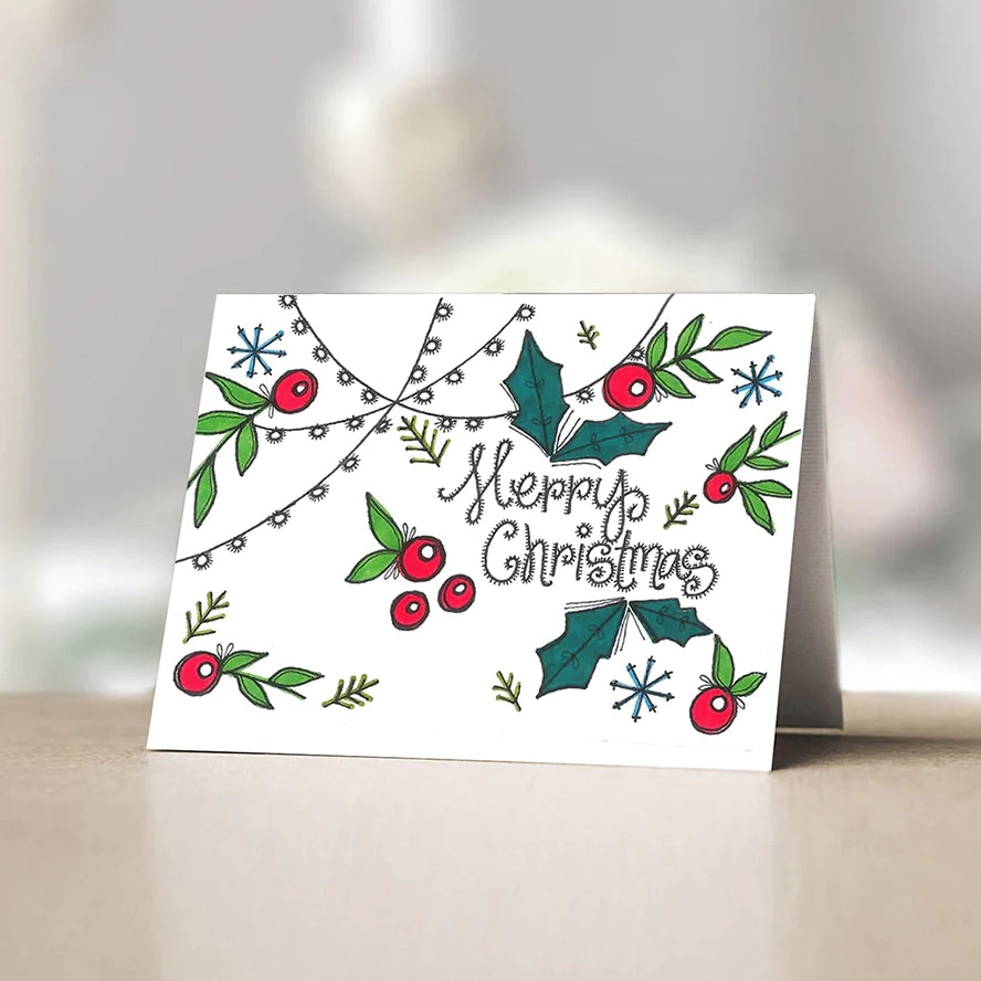 This card features beautifully illustrated holly leaves and berries in traditional red and green colors.