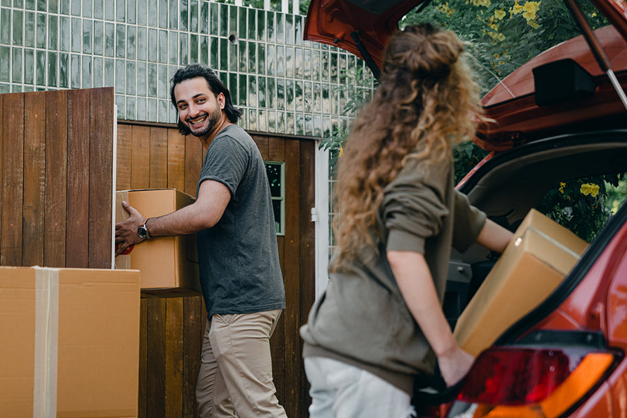 Someone helping their friend move.