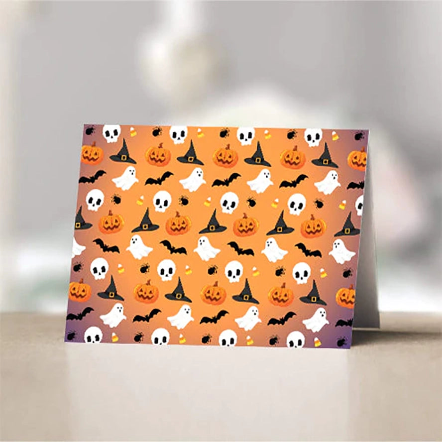 A card with a repeating pattern of ghosts, witches, and other Halloween characters on orange.