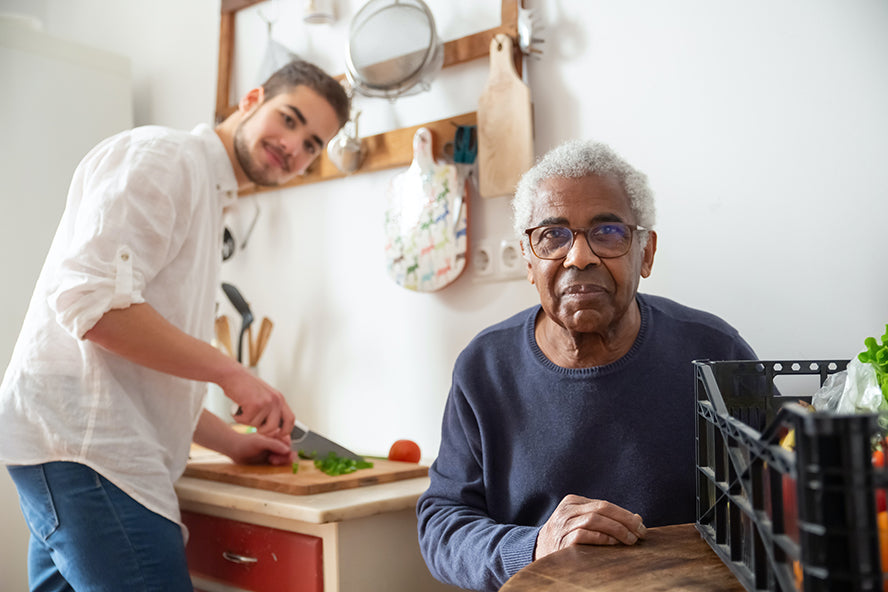 An elderly man recieving home care.