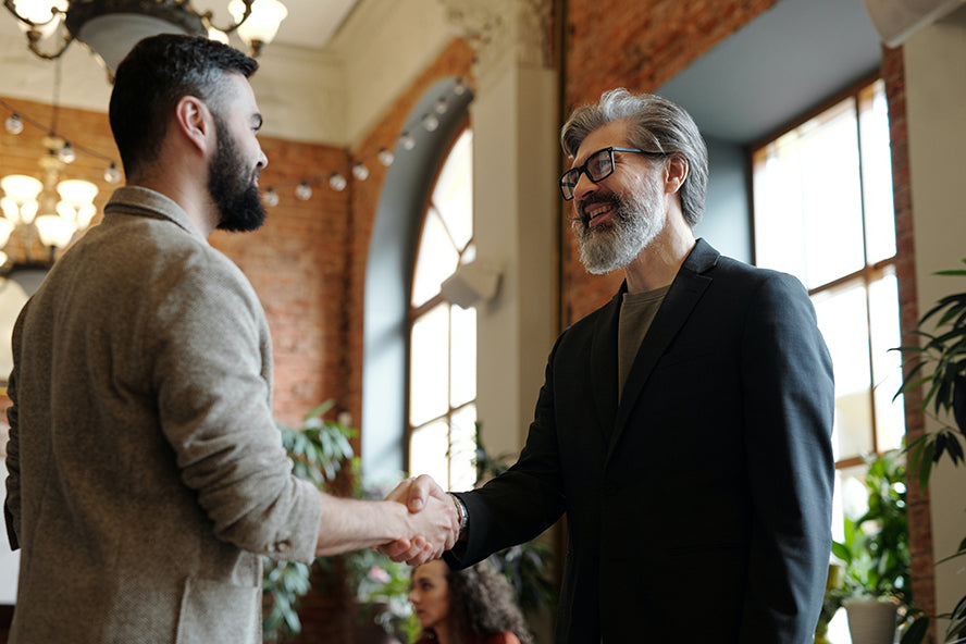 Two business associates shaking hands.