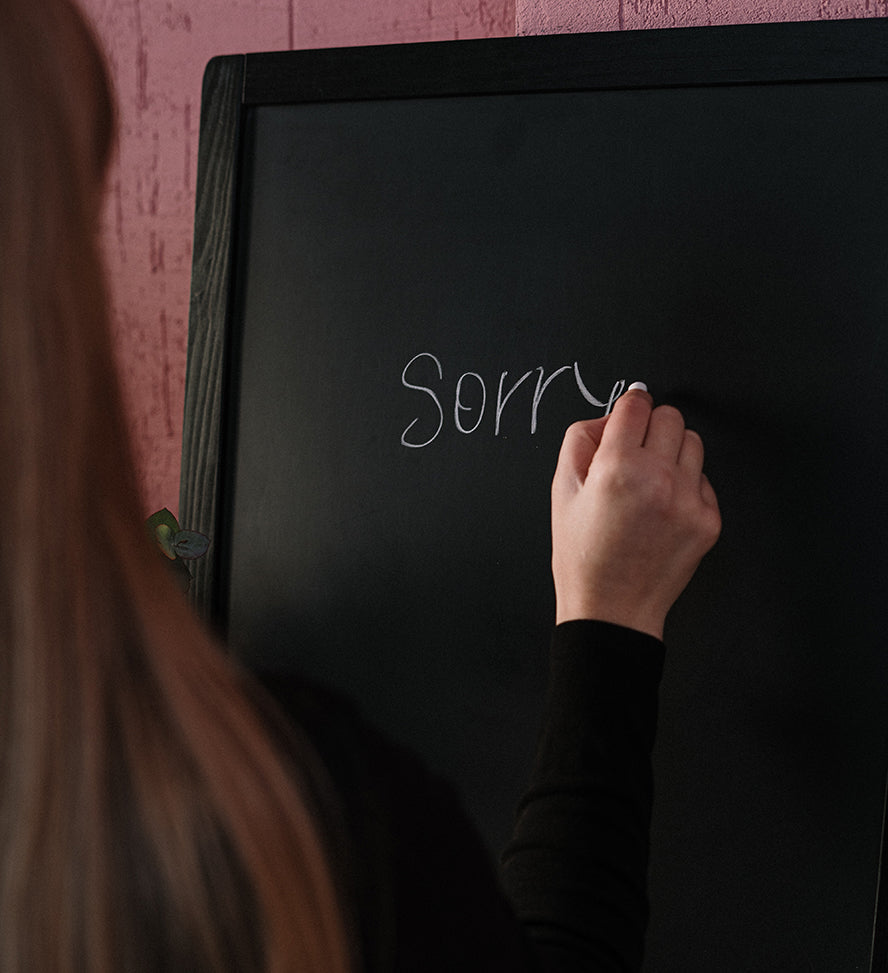 Restaurant employee writing 