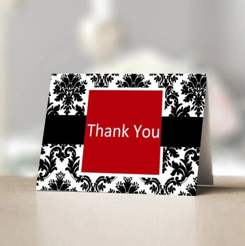 Thank you card with red, black and white design.