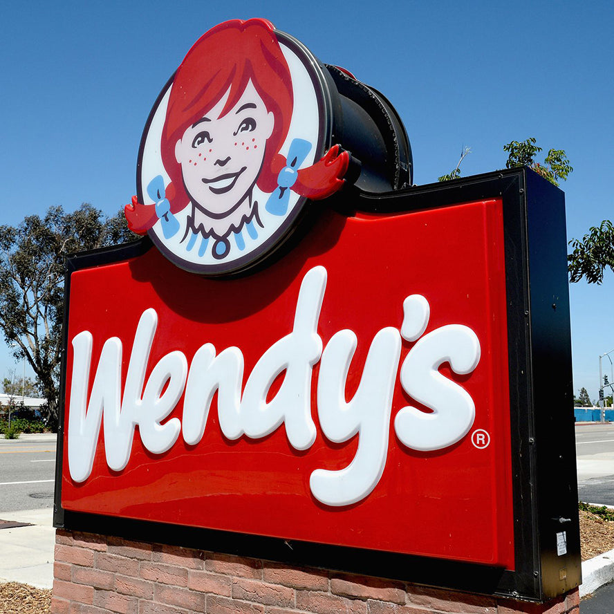 A Wendy's restaurant sign.