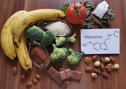 Food for good sleep with structural chemical formula of melatonin. Melatonin is a hormone; regulates the sleep-wake cycle. Healthy food for getting sleep: banana, chocolate, almond, tea, walnut, cocoa