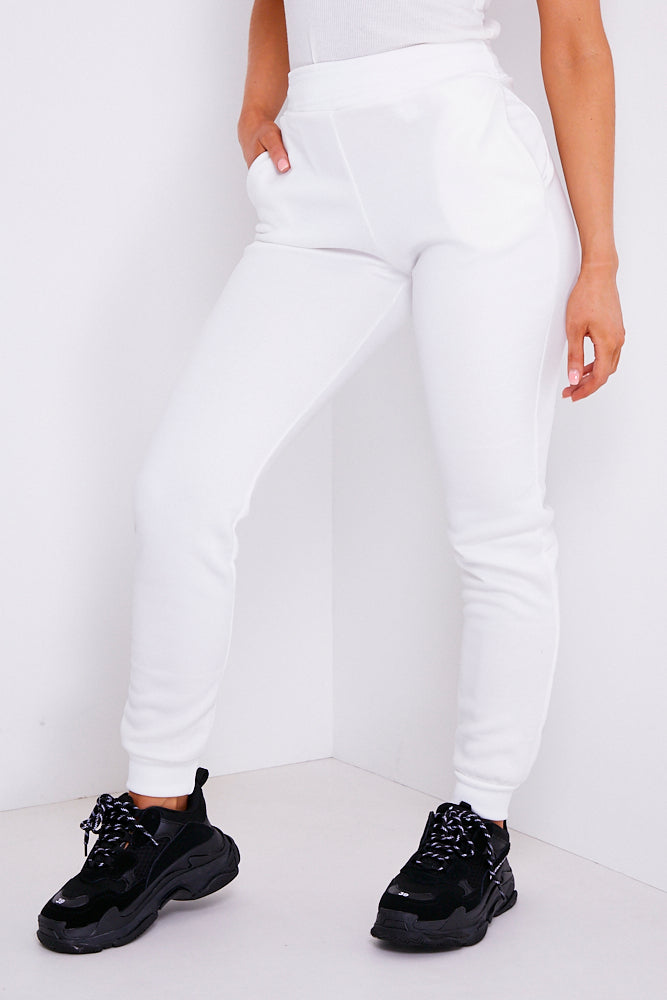 white slim joggers