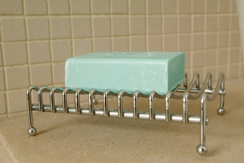 Bar of soap in wire soap dish