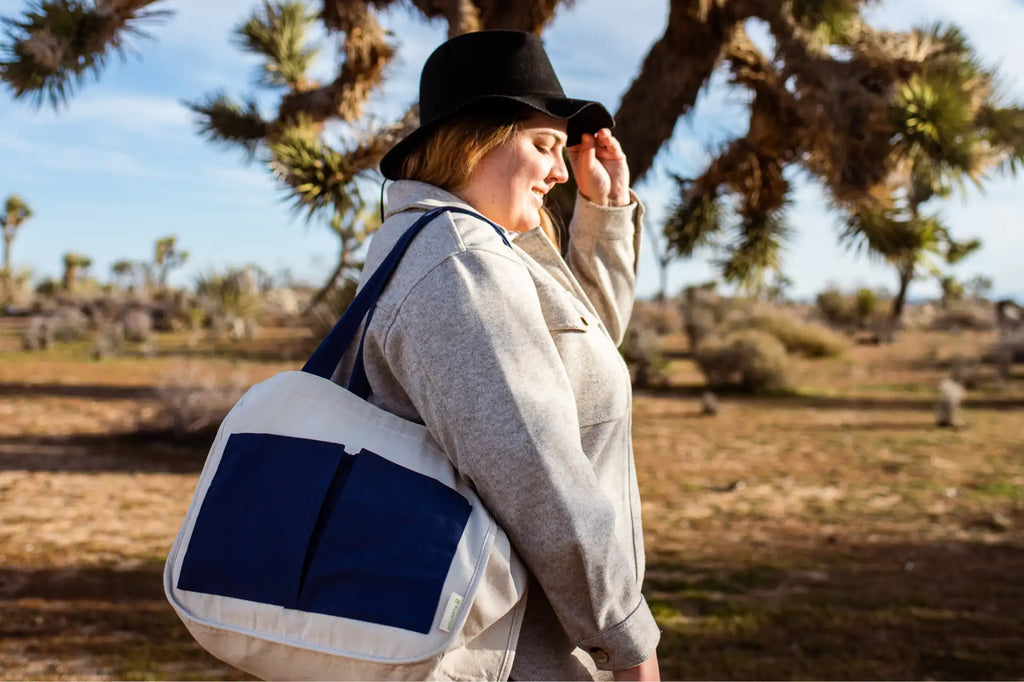 Woman using a multipocket tote bag in California