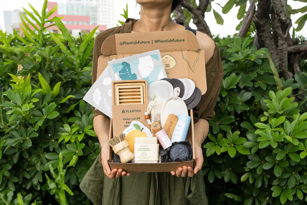 Lydia holding a box full of zero waste, plant-based and vegan products