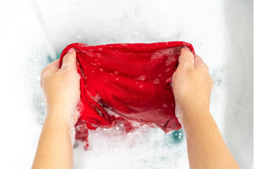 Person removing a stain through handwashing