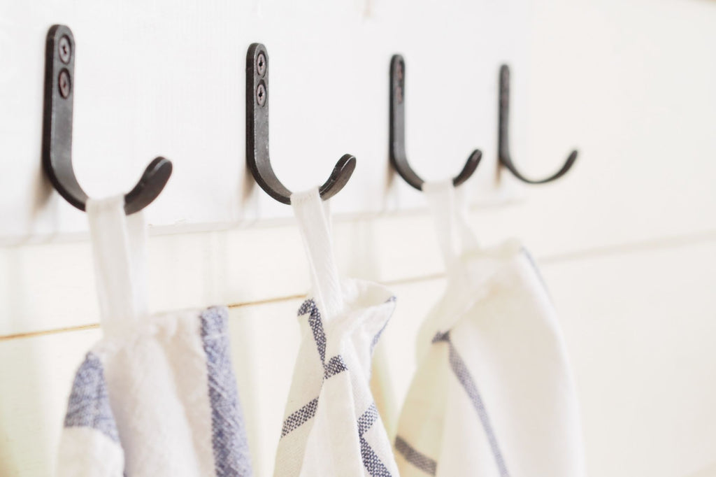 Kitchen hooks with hanging dish cloths