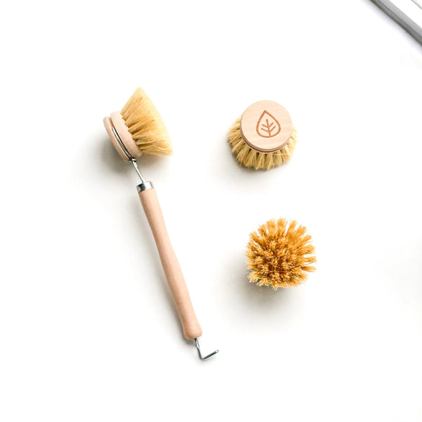 A bristle bamboo brush with 2 refill heads
