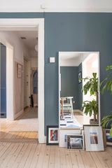 Mirror in dining room with view of entryway