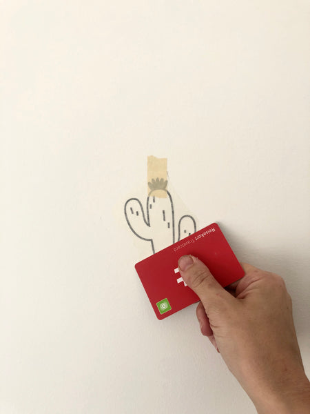 application of cactus wall decal with scraper