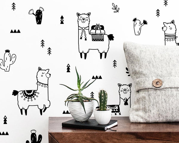alpaca and cactus wall decals above credenza with plant and pillow 