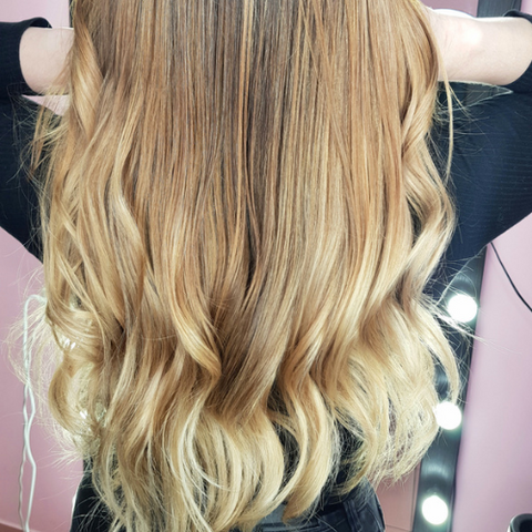 Woman with long Beach Bronde hair color