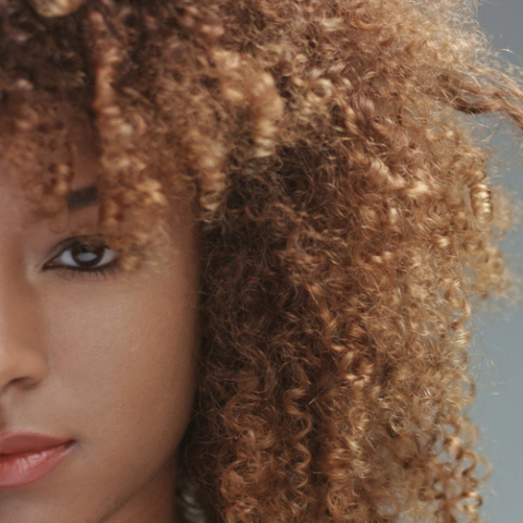 African American woman with Curly light hair