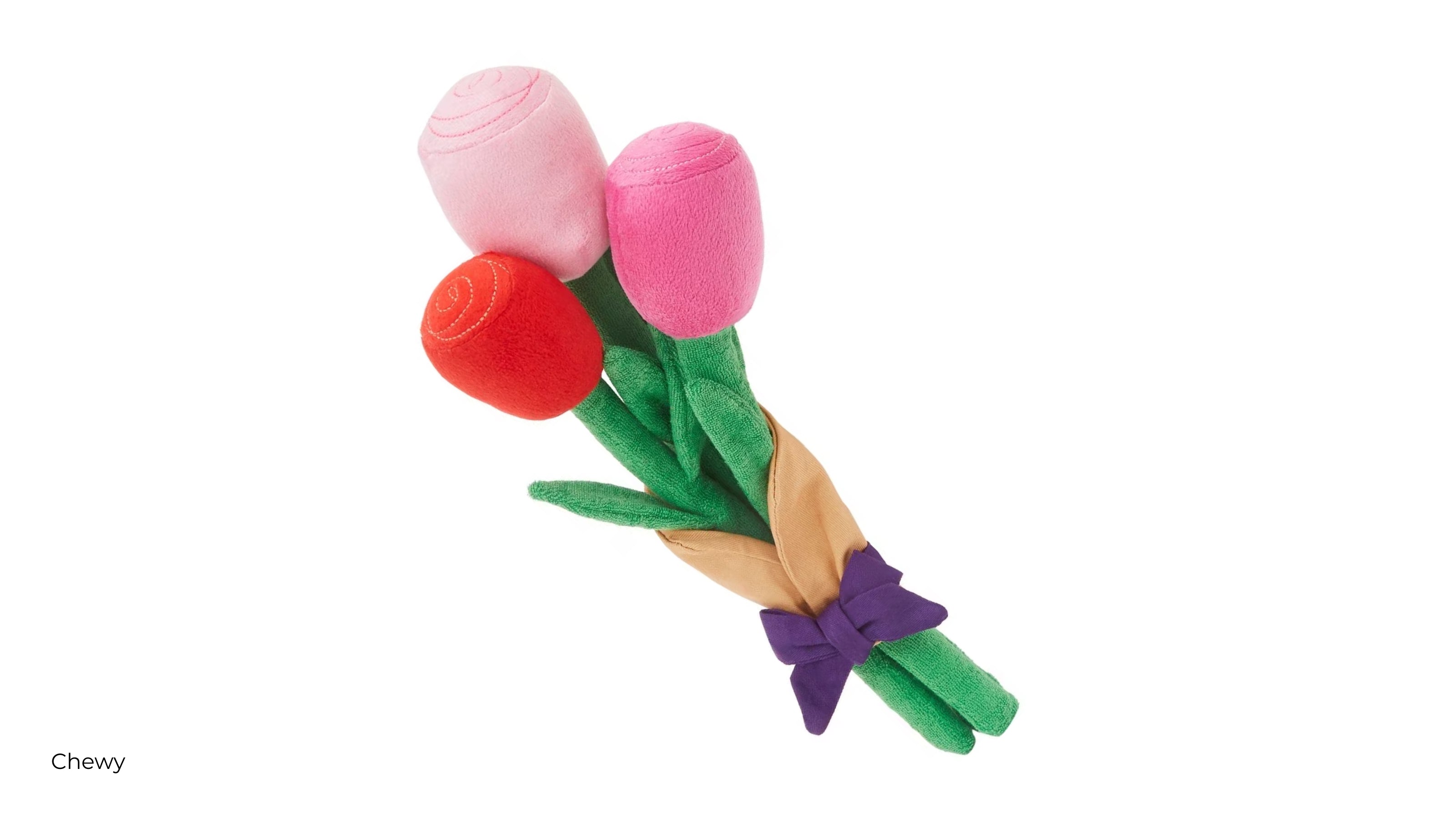 A bouquet of flowers dog toy with red light pink and bright pink buds and a purple ribbon tying them together