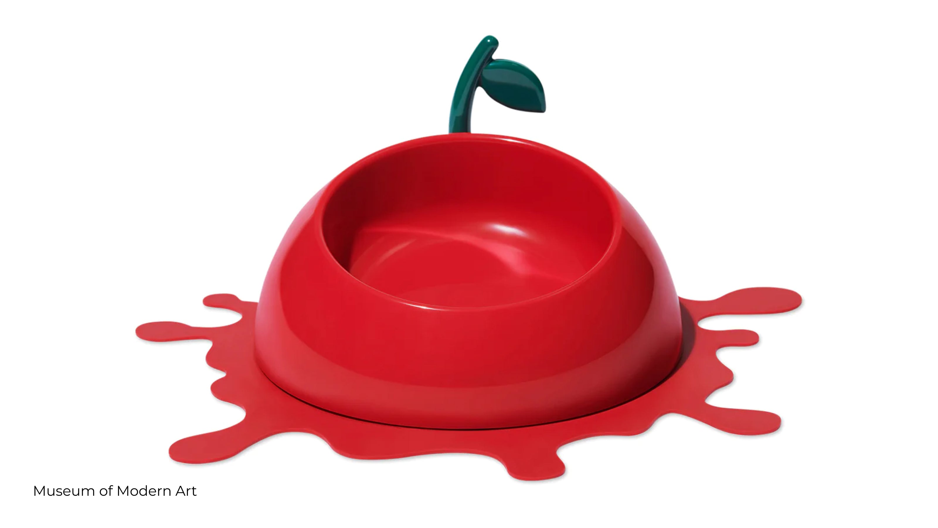 A red cherry pet bowl spoon and spill mat from the Museum of Modern Art