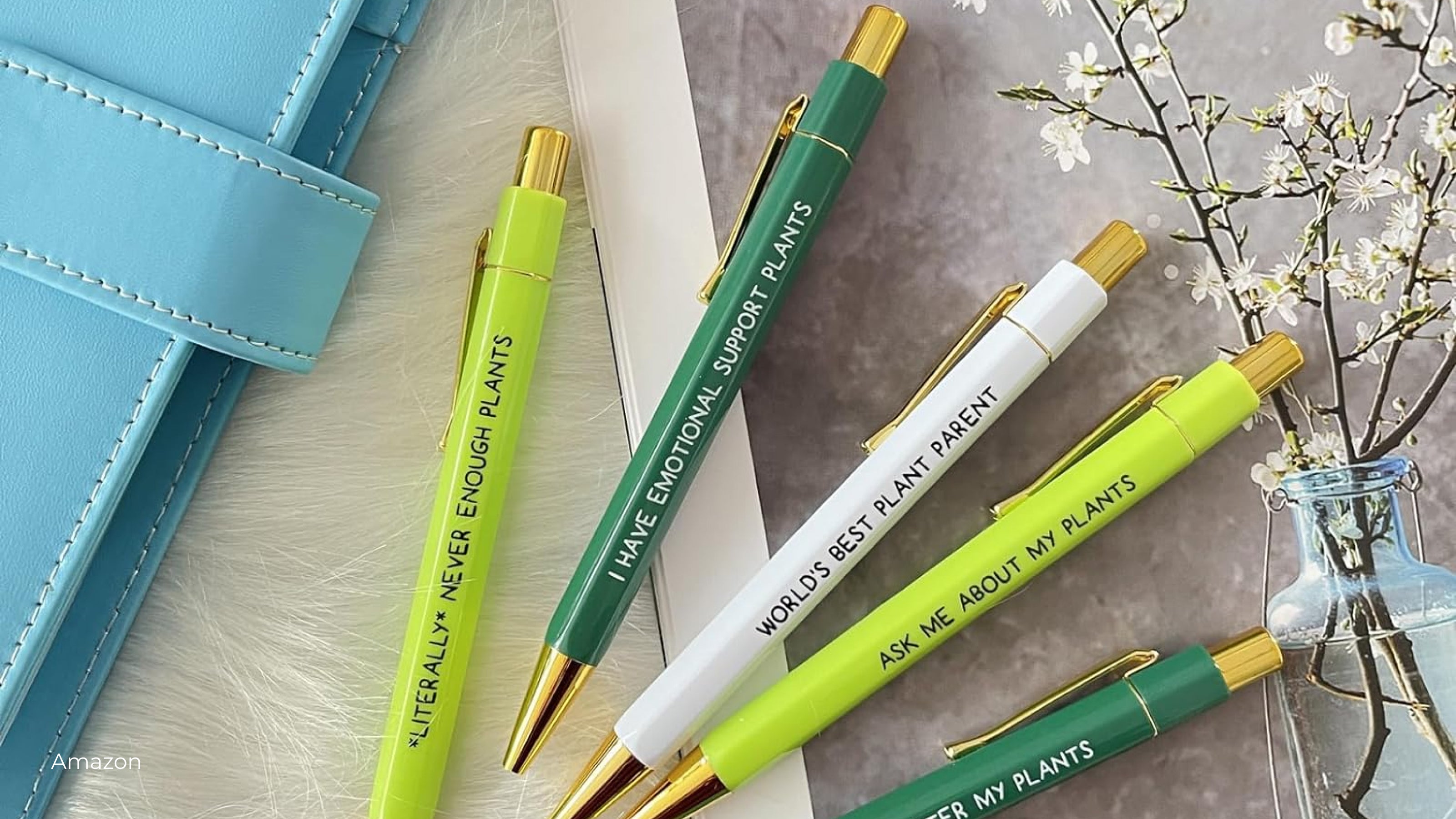 A set of green and white plant saying pens from Amazon