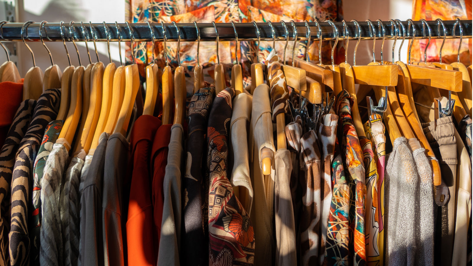 A thrift re-sale store rack with fall clothes
