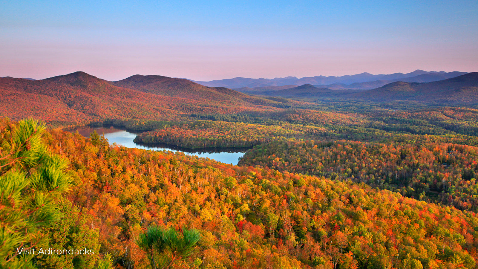 Adirondack Park New York river and fall trees along hillsides