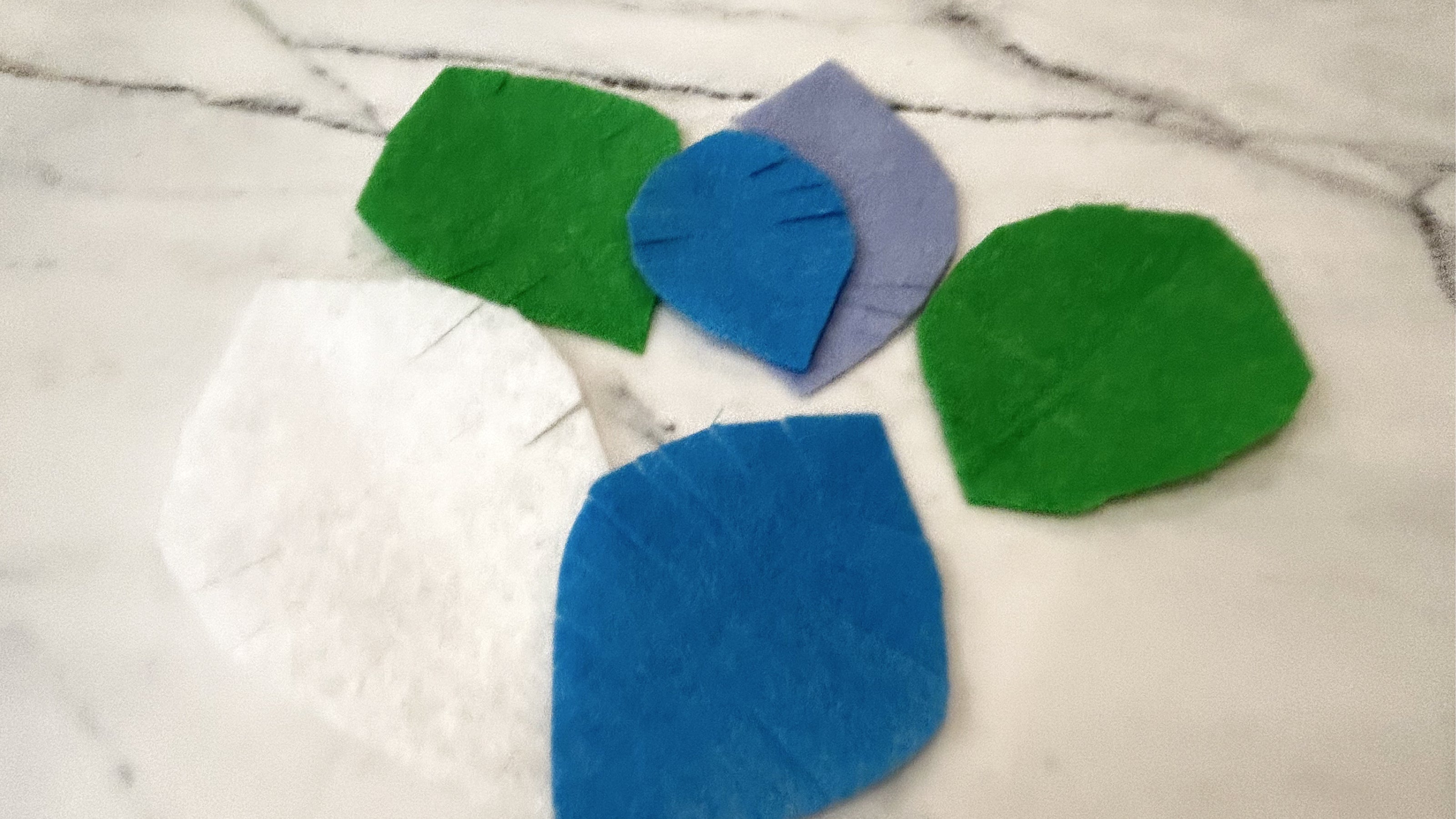 Felt oval leaves sitting on a countertop