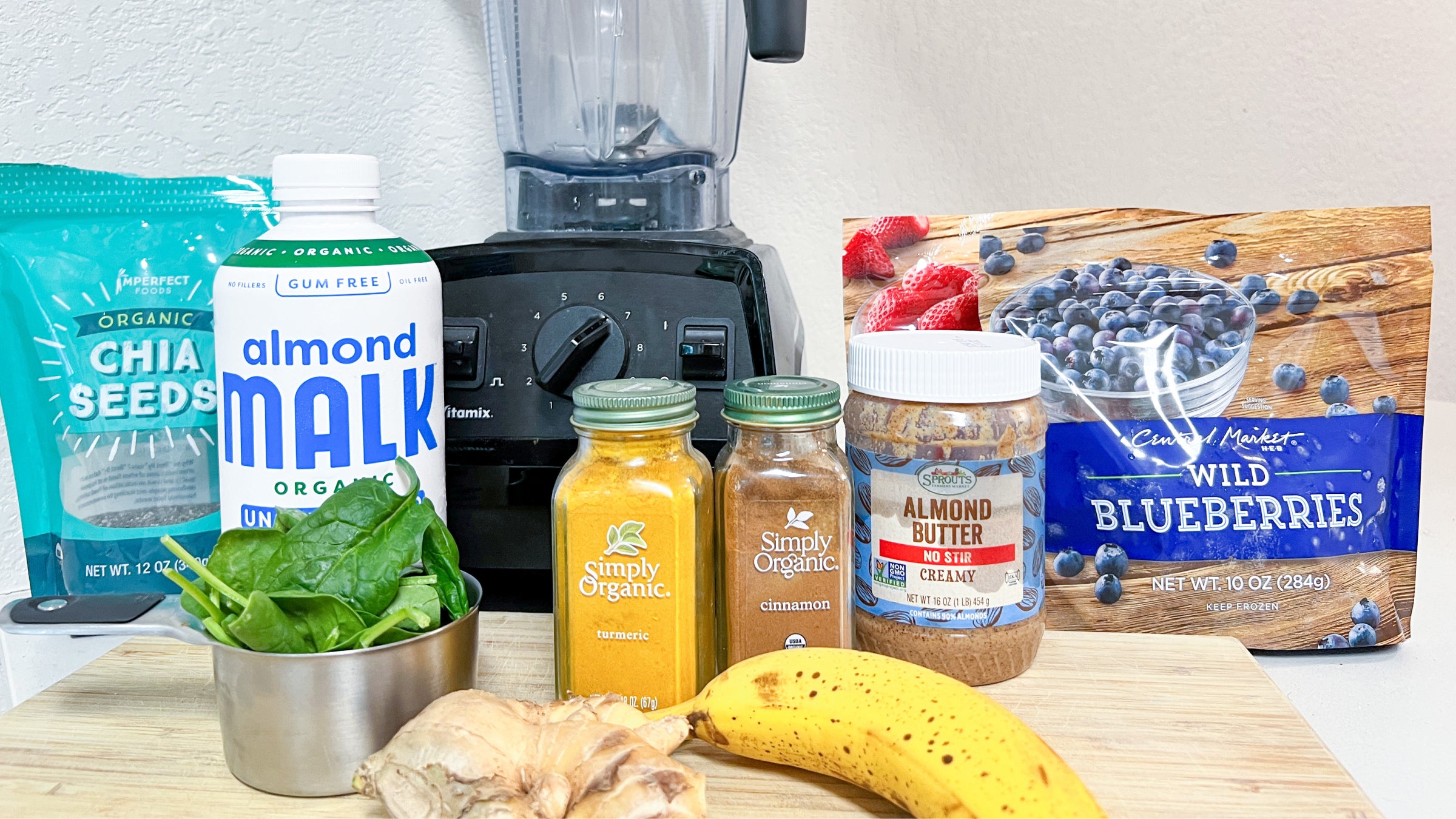 Ingredients for Wondercide immune boosting smoothing set next to a vitamix blender