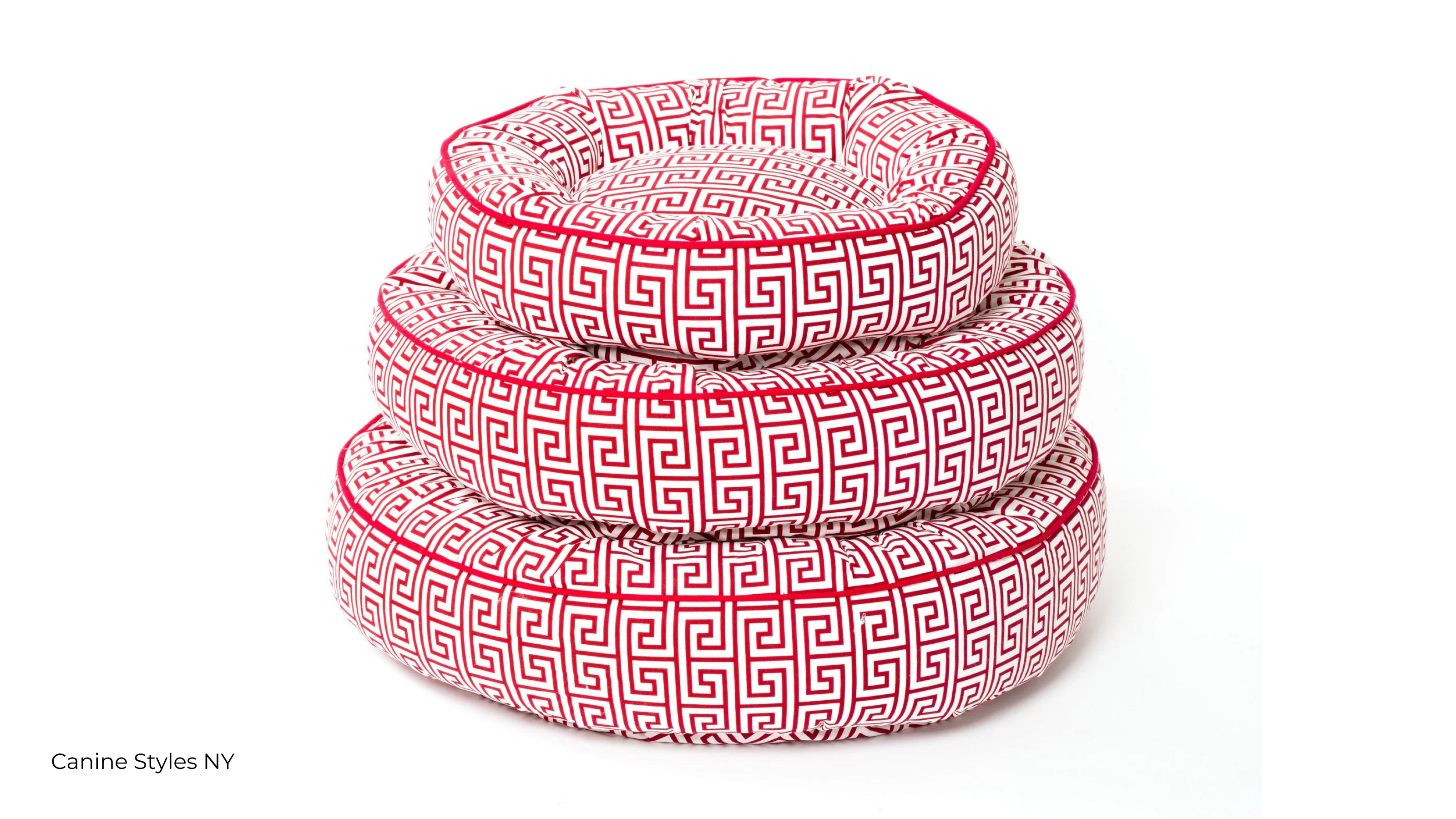 Red Greek key pattern bolster dog bed in three sizes stacked vertically