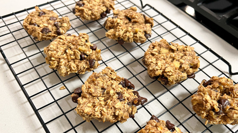 Two rows of cookies cooling on a metal wire rack