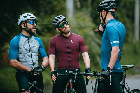 three men wearing bycicle goggles