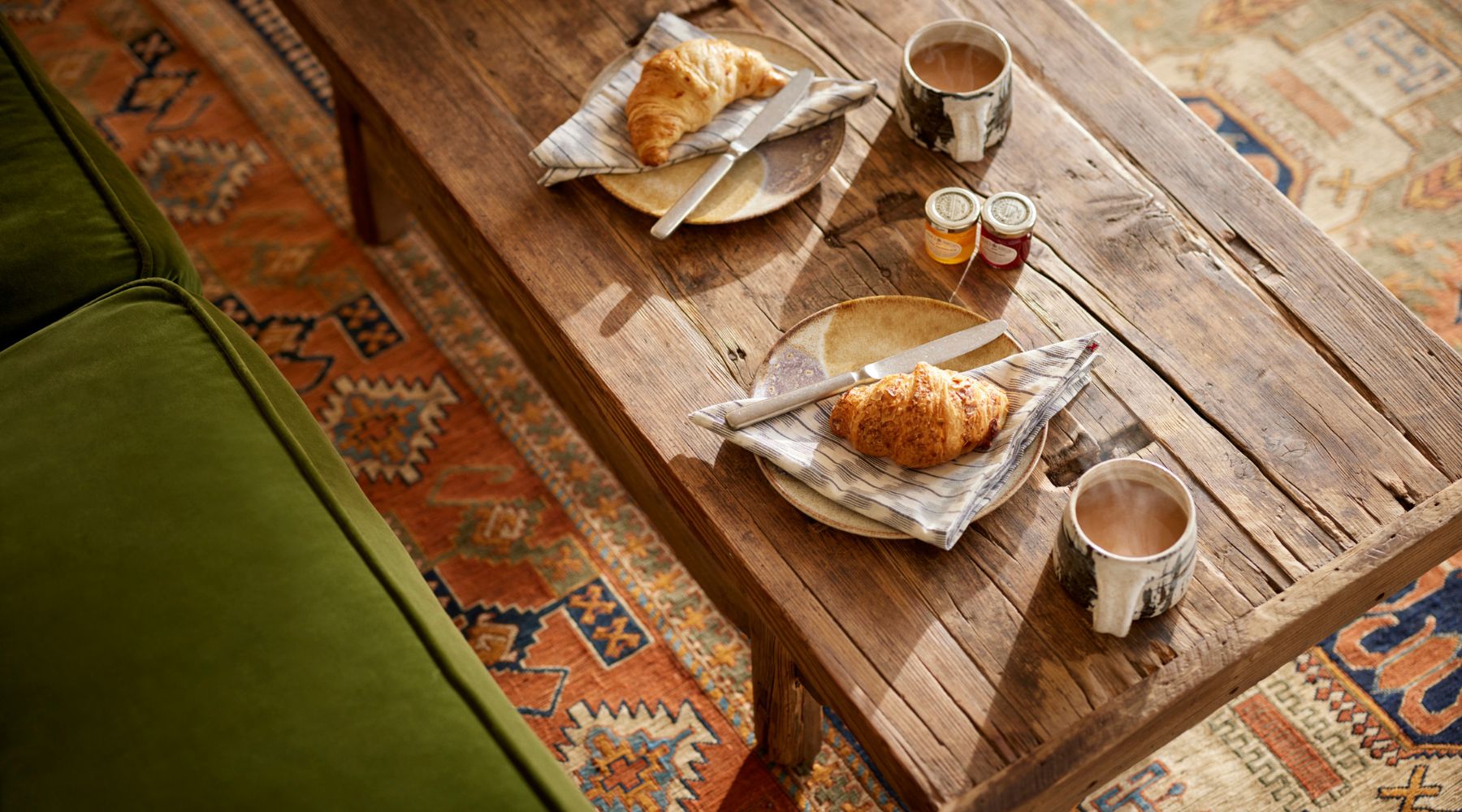 Omaze Million Pound House Lake District - Rustic wooden table with hot coffee and croissants