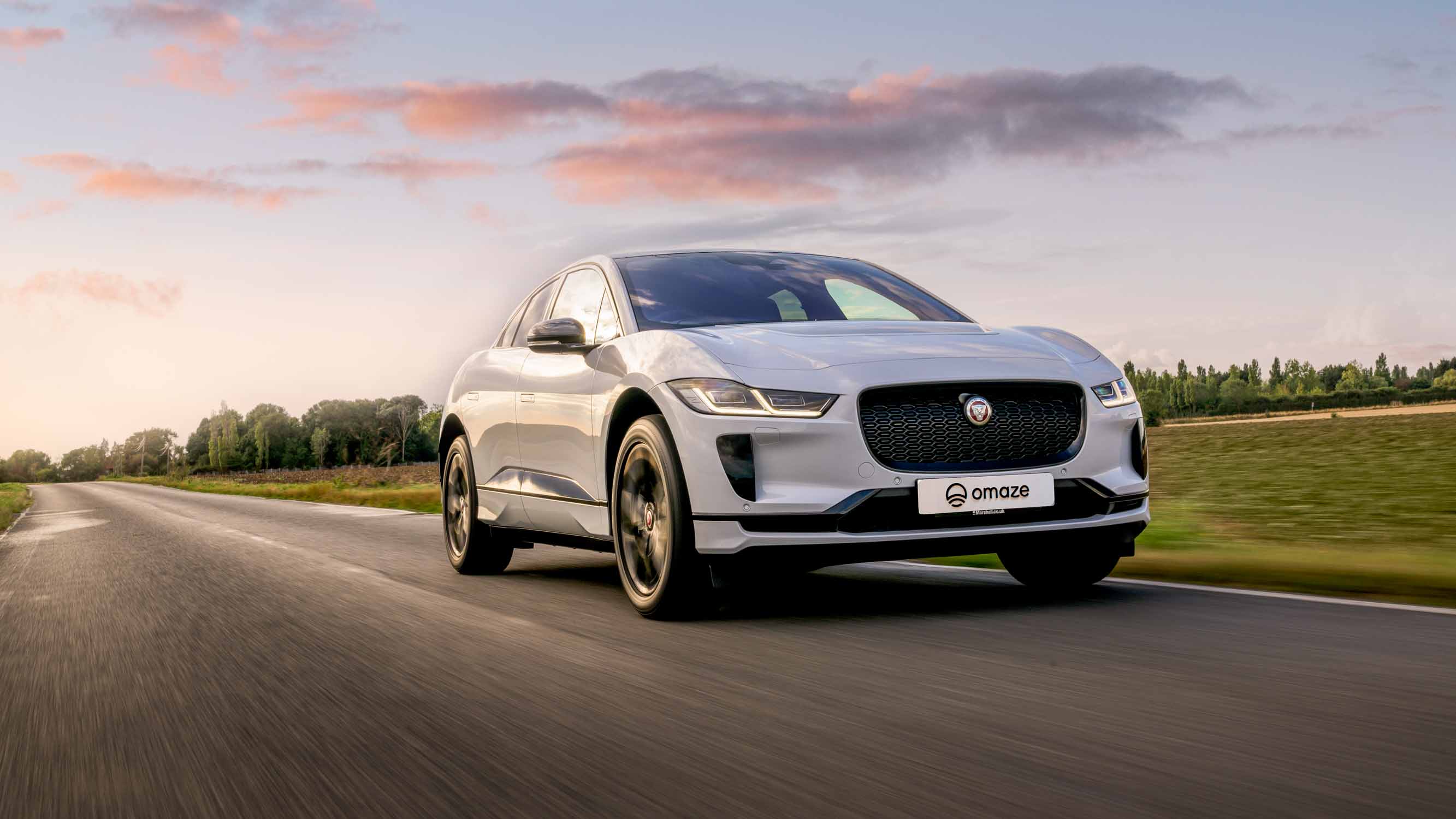 Win a Jaguar I-Pace in the Omaze Marbella Superdraw - Jaguar I-Pace being driven along the road